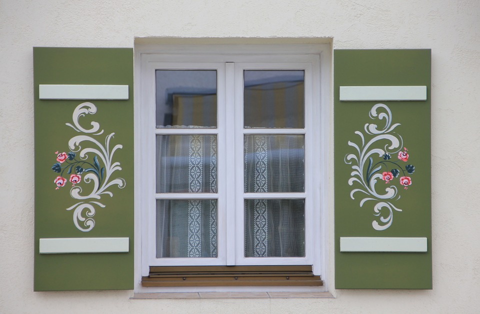 Window with decorated shutters Four Ways to Update Your House to Make It Perfect for Your Family 