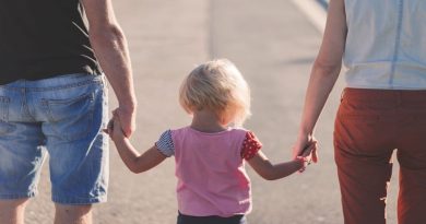 Parents holding their little girls hands -3 Places You Have To Keep Your Children Safe