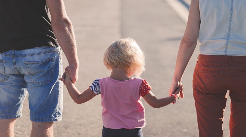 Parents holding their little girls hands -3 Places You Have To Keep Your Children Safe