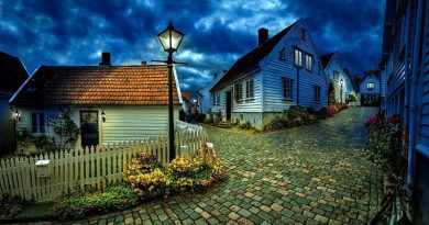 Little Houses at Dusk on a Cobble Stone Road