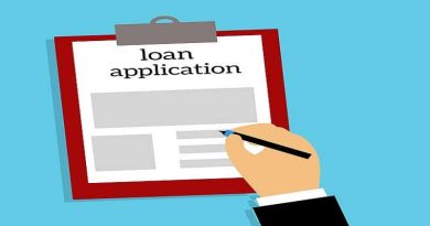 Loan Application on Clipboard Why You Might Need a Small Loan