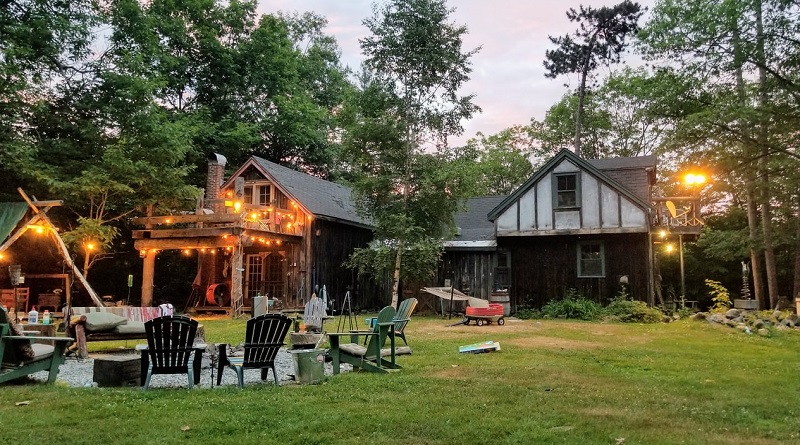 Backyard at Dusk w/ Adirondack Chairs, Hanging Lights and Fire Pit - Summer Backyard Essentials