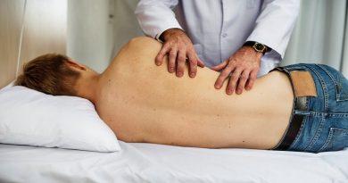 Doctor adjusting man on table -Aching Back? 5 Ways to Find a Chiropractor to Get You Back in Shape