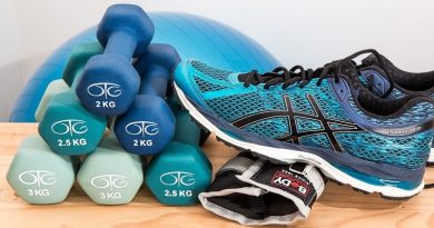 Dumbells and workout shoes - Workout Essentials To Make Exercise Easier