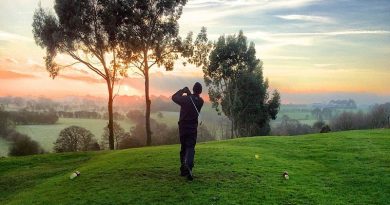Golfer hitting a ball - 7 Fantastic Gift Ideas for Your Golfer Friend
