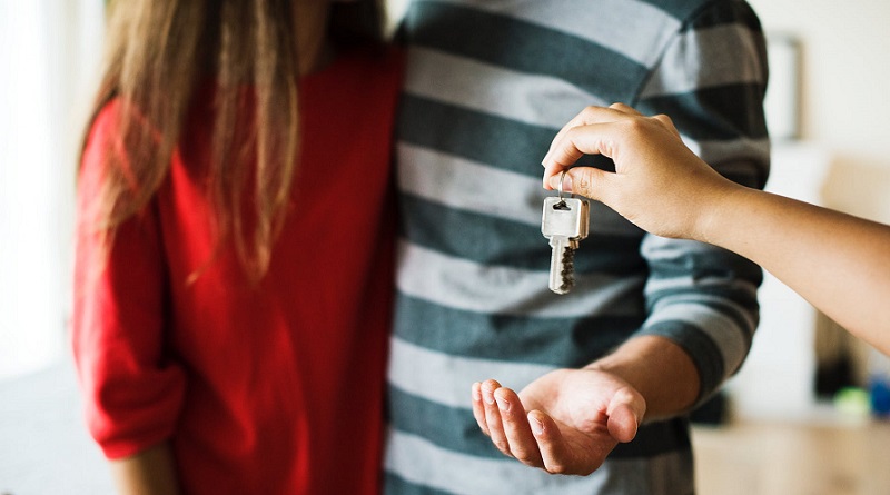 Handing House Keys to Couple - 4 Things You Need To Fix Before You Sell Your House
