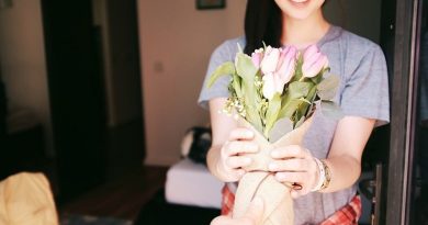 Woman receiving a bouquet of flowers - Best Gifts for A Business Lady