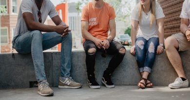 4 People Sitting on a Low Ledge - Mental Breakdown