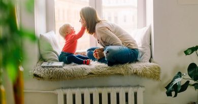 Mother and Child in Window Seat - Make Your Home Safer
