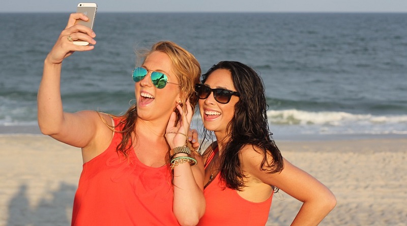 Two Girls on Beach taking a Selfie - How To Perfect Your Sizzling Selfies