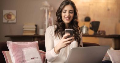 Woman with Laptop and Cell Phone -