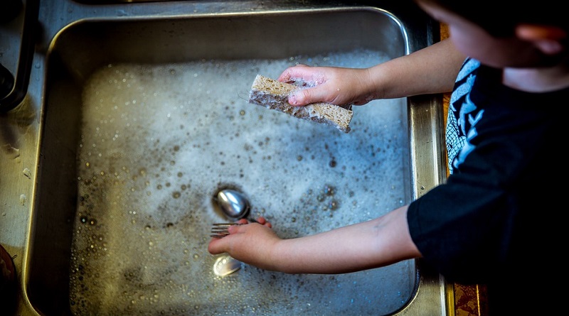 Little boy washing dishes - Giving a Child More Responsibility at Home