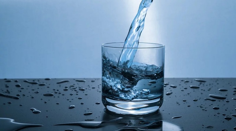 Water Pouring into Glass - Whole House Water Filtration Buying Guide