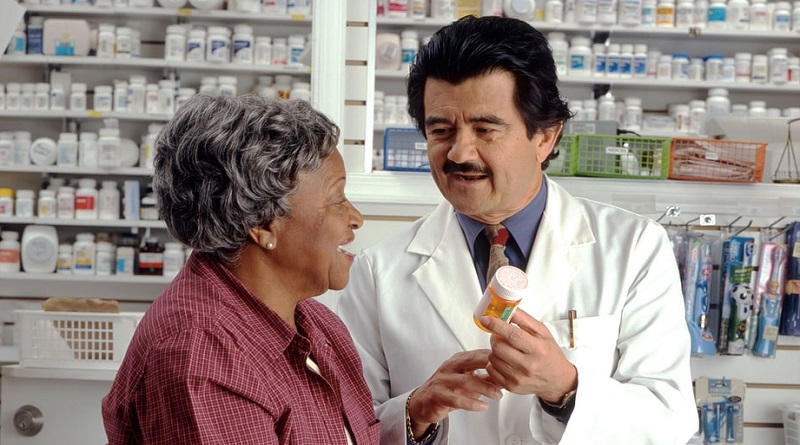 Woman Consults with Pharmacist - Human Error at any Pharmacy