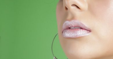 Close up of woman's lips with Pink Frosted Lipstick on - Debunking Myths on Lip Fillers