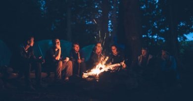 Group of Friends Around a Camp Fire - Make the Most of a Camping Adventure