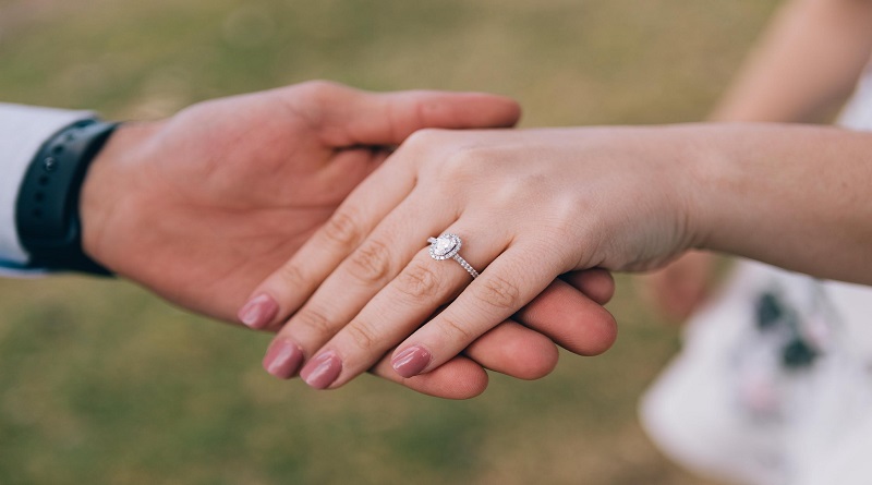 Couples Hands Showing Engagement Ring - The Perfect Engagement Ring