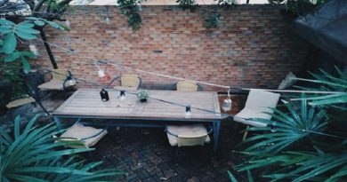Garden deck with table chairs and strung lighting - Decorative Ideas For Your Garden Decking