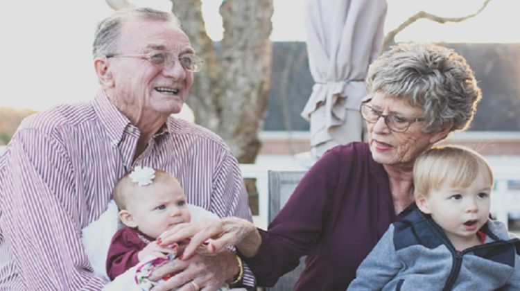 Older couple with two grandchildren - Retirement Living Community