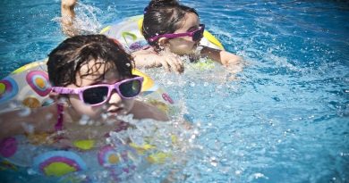 2 little girls wearing pink sunglasses in a pool - De-Winterize your Yard