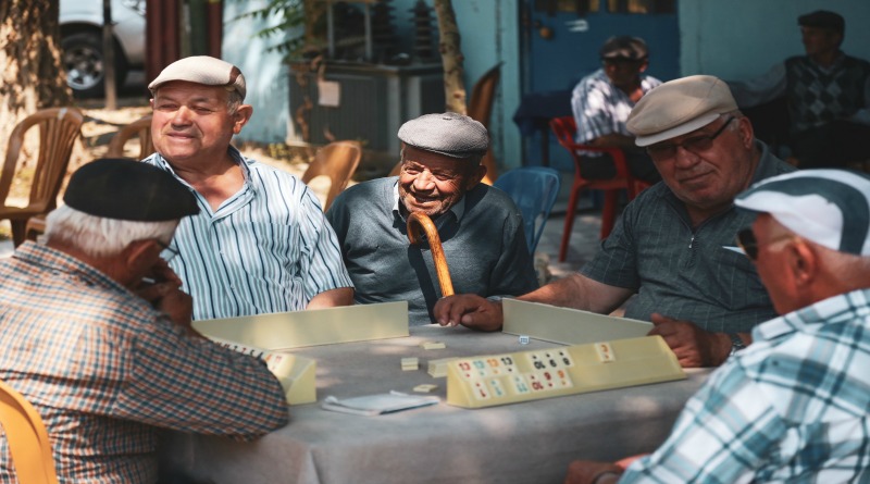 Older Men Around a Table - Senior Living Communities