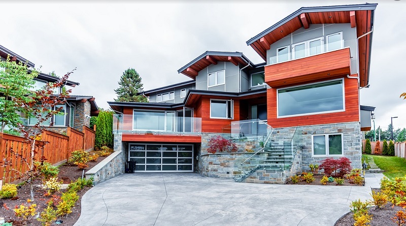 Modern Grey Brick Home with Red Trim - Home Exterior