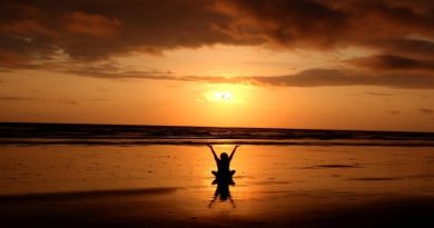 Person on the beach at sunset - Find Balance And Keep It