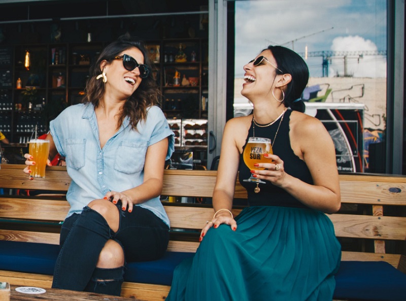 Two women laughing together - Feel More Alert