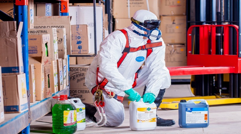 Person in PPE with Chemicals - Spill Response Procedure