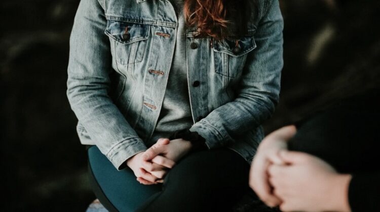 Woman in jean jacket and man - Hiring a Couples Counselor