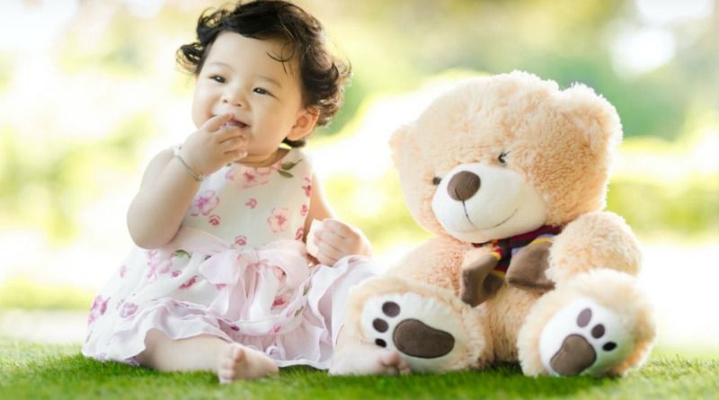 Baby Girl in Floral Dress sitting on Grass with Teddy Bear - baby girl clothes