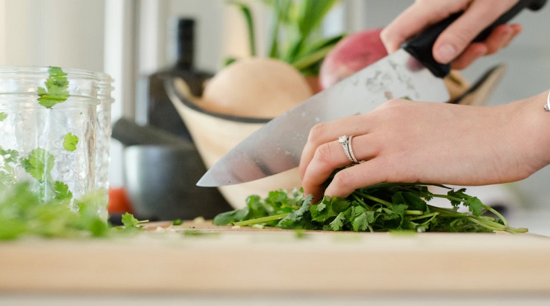 Hands chopping parsley - Meal Prepping Made Easy