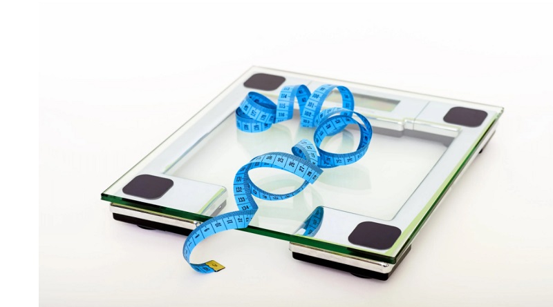 Scale and Measuring Tape Lose Stubborn Body Fat