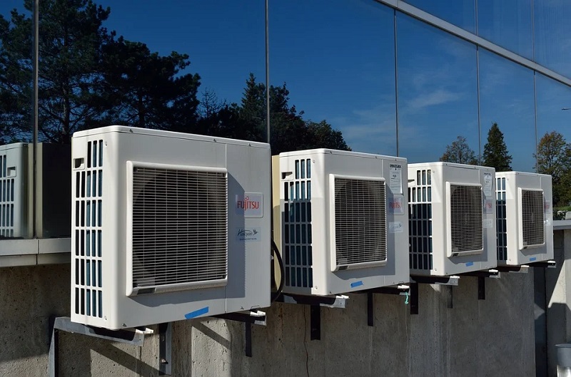 Troubleshooting Your HVAC Ventilation Issues Air conditioners lined up on outside of building