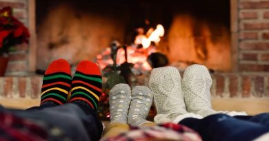 Create a More Comfortable Environment Family in Socks sitting in front of a fire