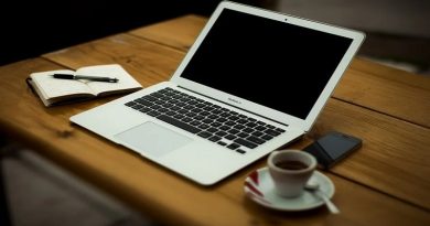 Interior Design Choices When Working From Home Laptop on Wooden table with coffee cup and cell phone