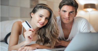 Things To Consider Before Buying A Home Young couple making purchase from home via the internet