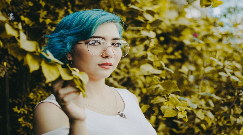 DIY Your Hair Color Woman wearing glasses with blue hair