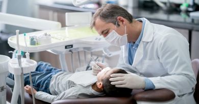 Things Every Parent Should Know About Baby Teeth Pediatric dentist checking teeth on a boy