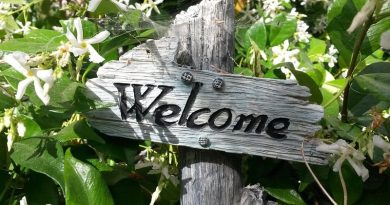 Garden Upgrades Made Easy Welcome sign in garden