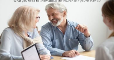 Couple signing papers What you need to know about life insurance if you’re over 50