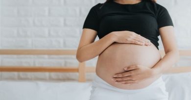 Woman holding her pregnant belly