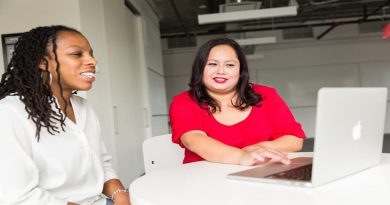 Reduce Unwanted Down Time In Your Business 2 women working on Laptop placed on round white table