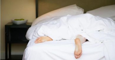 CBD: The Unsung Hero of Sleep Aid Persons feet showing out from under bed sheets