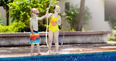Keeping Your Kids Safe by the Pool Kids playing with water house by backyard swimming pool