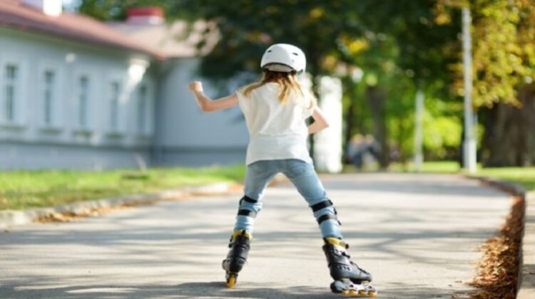 Get Your Child More Active Outdoors Little girl rollerblading in the park