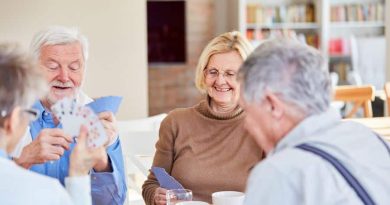 Senior Adults enjoying a game of card