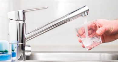 Benefits of a Water Treatment System Water running out of tap into clean glass