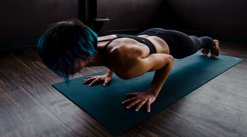 Basement Home Gym Woman Working Out on Mat on Floor