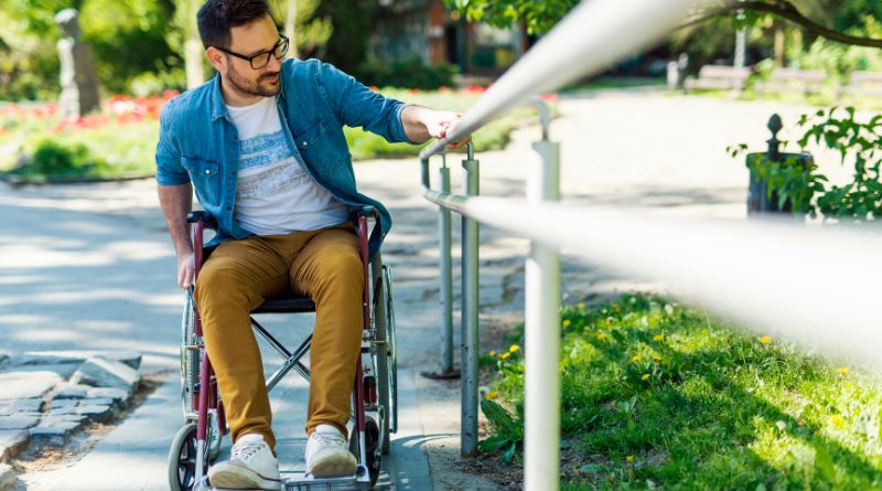 Man in Wheelchair on Residential Wheelchair Ramp